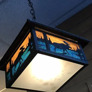 a hanging light in a restaurant