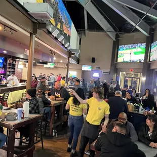 a large group of people at a bar