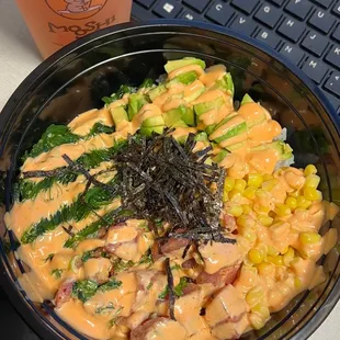 Poke bowl with tuna, white rice, corn, avocado, seaweed salad, topped with spicy mayo &amp; ponzu