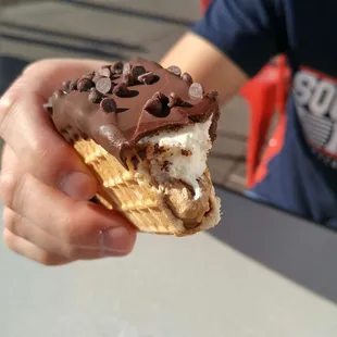 Ice Cream Taco - Vanilla ice cream with cookie dough bottom, dipped in chocolate and topped with chocolate chips.