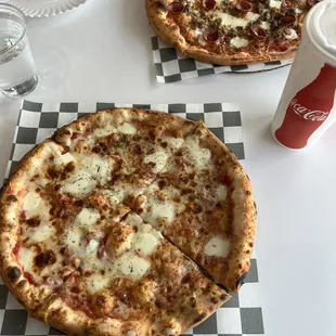 Cheese pizza and meat lovers pizza
