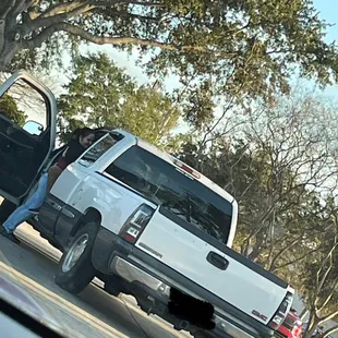 a white truck with its door open