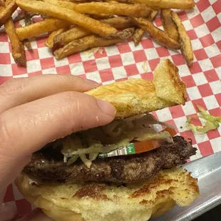 plain hamburger (tomato with produce sticker still on)