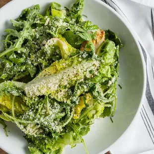 Little Gem Salad with Little gem lettuce, Meyer lemon, Anchovy, Egg White Dressing, Radishes, and Garlic Croutons