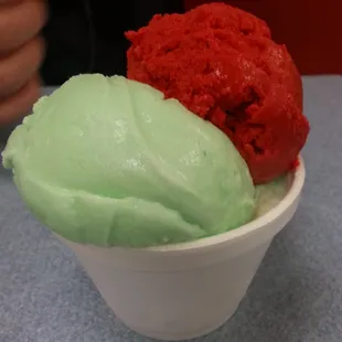 Agua Ice cream.  $3 dollar cup which is 3 BIG scoops. Green = Delicious lime agua. Red = strawberry agua.