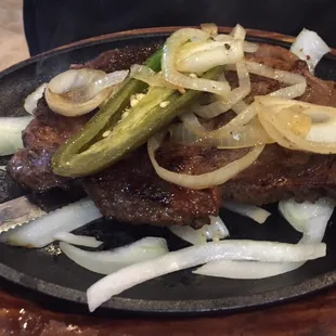 Ribeye.  Very tender and flavorful. Comes with a side on the next picture.