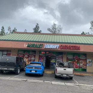 cars parked in front of store