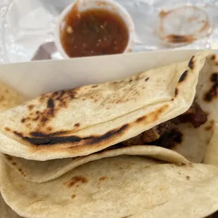 a close up of a plate of tacos