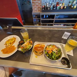 Grilled Cajun grouper with rice and Hawaiian chicken sandwich with salad