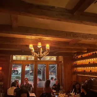 people sitting at tables in a restaurant