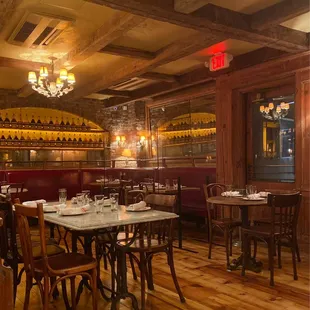 a restaurant with wooden tables and chairs