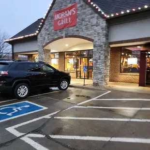 a car parked in front of a restaurant