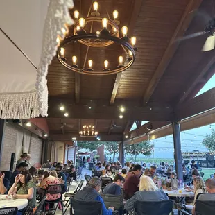 a large group of people sitting at tables