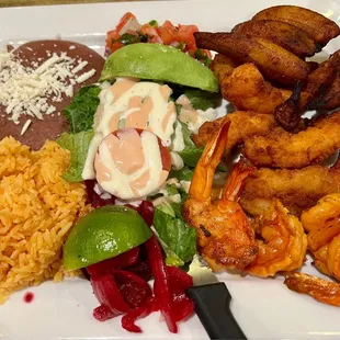 Camarones y platanos con arroz y frijoles y ensalada. It was so delicious and so much food we have enough to take home for another meal!