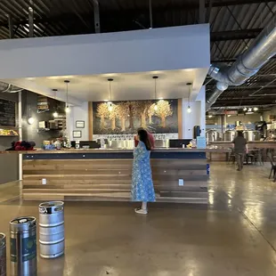 a woman standing at a counter