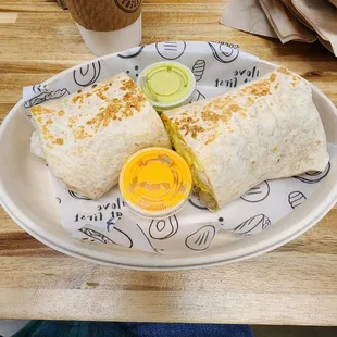 Breakfast Burrito (scrambled eggs, cheese, tater tots, bacon, avocado)