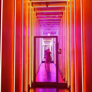 a hallway with neon lights