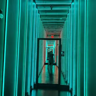 a hallway with neon lights