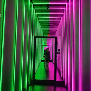 a hallway with neon lights