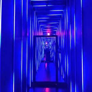 a hallway with blue lights