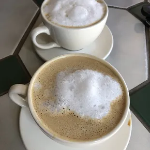 two cups of coffee on a table