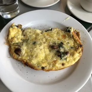 an omelet and a cup of coffee