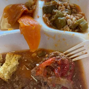 a plate of food with meat, rice and vegetables