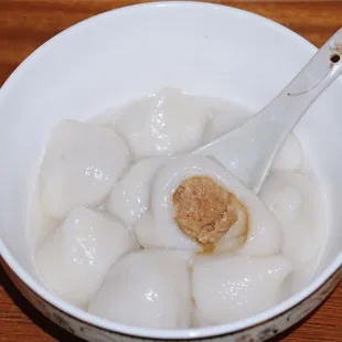 a bowl of food with a spoon in it