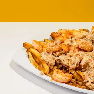 Garlic Crab and shrimp loaded fries.
real blue crab meat with shrimp, with cheese and fresh cut fries