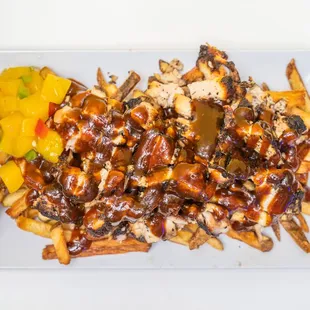 Jerk Chicken Fries with mango salsa