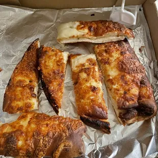 Burnt cheese breadsticks.