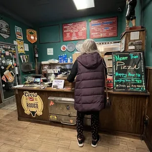 a woman standing at a counter