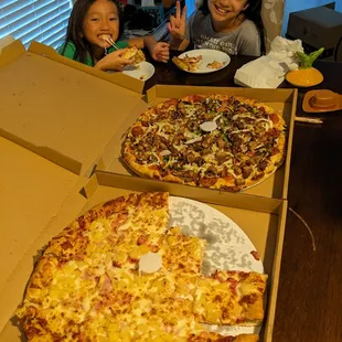 Top pizza: Combination Bottom pizza: 2 toppings special with pineapple and ham.