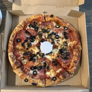 Three toppings - pepperoni, salami, olives