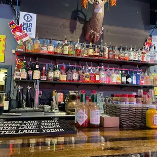 a bar with a deer head on the wall