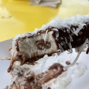 Banana Filled with Nutella Hazelnut dipping Coconut flakes on top