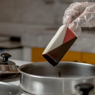 a person in a kitchen preparing food