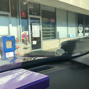 Store front with open sign on, during business hours but doors locked. Smh!