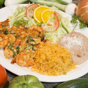 a plate of food with rice and vegetables