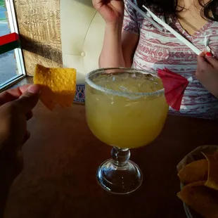 That is a large Margherita!  Note the chip in my hand for size comparison.  What the he'll does a medium look like?