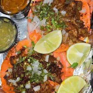 The al pastor tacos are flavorful and juicy.Both Salas are good, but the red is a winner for me.