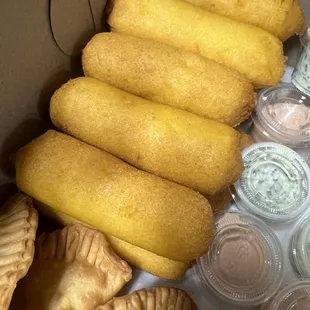 Sorullos and breakfast empanadas (ham eggs and cheese, bacon eggs and cheese)