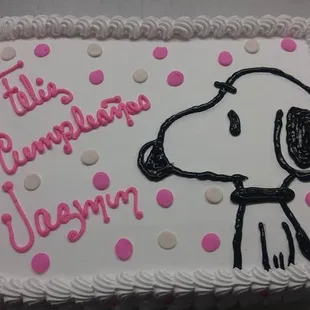 a cake with a dog on it