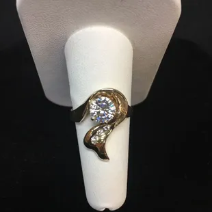 This Design is available in many variations.  Diamonds, Moissanites, and Colored Stones