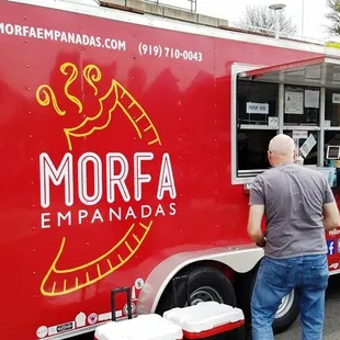 people ordering food from a food truck