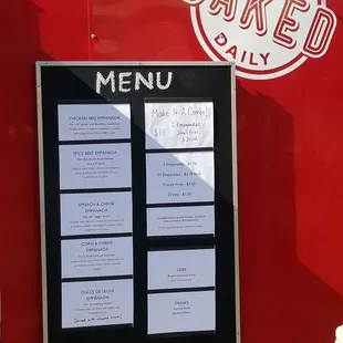 a menu on a red food truck