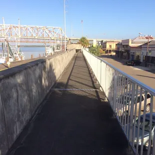 On top of the flood wall between the Atchafalaya River and Front Street.