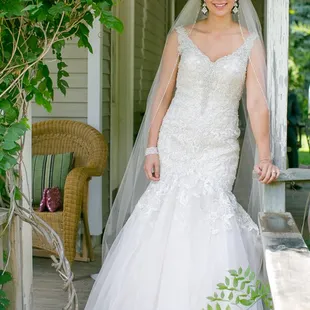 a bride standing on a porch