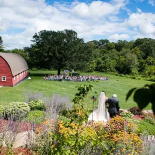 a bride and groom walking down the aisle
