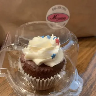 Red velvet cupcake with cream cheese icing.